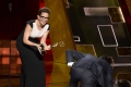 Jon Hamm accepts an award at the 67th Emmy Awards